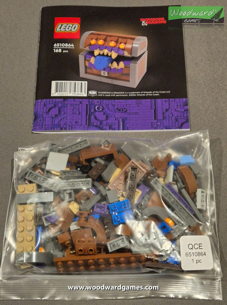 The unboxed Lego Mimic Dice Box / Chest with instructions manual and unopened bag of lego pieces - Woodward Games